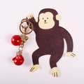 Detail view of red boxing glove keychains with sparkling rhinestones on golden chain - 10cm / Golden Red
