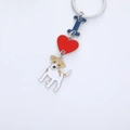 Detail of dog keychain with red heart, blue letter I, and Jack Russell Terrier charm - Jack Skellington