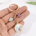 Handheld golden ocean theme keychain with purple starfish and seashell pendant charm - 7.5g / Marine Beach Purple Starfish (10)