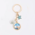 Golden dolphin and whale keychain featuring blue starfish and pearl shell charms - 7.5g / Marine Beach Blue Starfish (9)