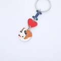 Cartoon dog keychain with blue letter I, red heart charm and orange enamel dog head - Saint Bernard