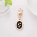 Vintage gold heart-shaped keychain featuring a black tulip pendant with pearl trim - Flower Style 5