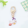 Close-up of ghost keychain with purple wizard hat and pumpkin basket on white background - Wizard Pink