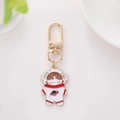Cute cartoon girl astronaut keychain with gold metal ring and red space suit detail - Astronaut Style Two