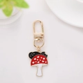 Cute red mushroom keychain with white hearts and black cat silhouette in enamel - Mushroom Style 1