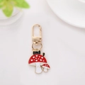 Cute black cat and red mushroom enamel keychain with gold finish and lobster clasp - Mushroom 2