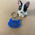 Blue cat-shaped metal pet ID tag with fishbone pattern and silver ring attachment - Blue