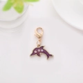 Golden dolphin charm with purple enamel finish and white star patterns for keychains - Fish 2
