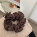 Minimalist dark brown satin scrunchie with textured fabric and elastic inner band - Coffee