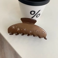Dettaglio della pinza per capelli marrone con motivi floreali in strass scintillanti - Caffè Strass Fiore