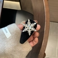 Elegant rotating snowflake hair clip with silver crystals on black velvet base - Rotating Snowflake Black Side Clip