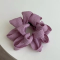Primer plano de un coletero de tela violeta que muestra el tejido grueso y núcleo elástico - Morado