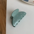 Franse stijl vlinder haarklem in Morandi groen met strass steentjes op witte ondergrond - Blauw