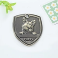 Placa para perro en bronce antiguo forma escudo con relieve de Corgi y grabado de PUPPY - Corgi (161)