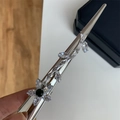 Detailed close-up of a silver hair pin with white marquise zircons and a green floral stone - Flower Zircon Duckbill Clip (E1-008)