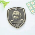 Antique bronze shield-shaped dog tag with embossed teddy puppy design and Puppy text - Poodle Style (169)