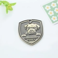 Antique bronze shield-shaped dog tag with embossed puppy design and PUPPY lettering - Bulldog (159)