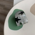 Sparkly silver-grey hair claw clip with black star pattern for trendy hairstyles - Mini Star Hair Claw