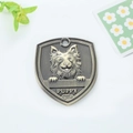 Shield shaped antique bronze pet ID tag with puppy relief and engraved puppy text - Icelandic Sheepdog Style (153)
