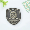 Antique bronze shield-shaped pet ID tag with puppy relief and engraved Puppy text - Shiba Inu (108)