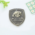 Antique bronze shield-shaped pet ID tag with puppy relief and bone icon engraving - Dalmatian (151)