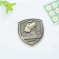 Shield-shaped antique bronze pet ID tag with embossed puppy head and bone patterns - Great Dane Style (162)