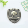 Antique bronze shield-shaped pet ID tag with puppy relief and puppy engraving - Afghan Hound (149)
