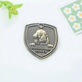 Antique bronze shield-shaped puppy pet ID tag with embossed dog and bone design - Basset Hound Style (150)