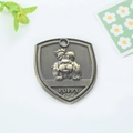 Shield-shaped antique bronze pet ID tag with puppy relief and engraved puppy text - Shih Tzu (165)