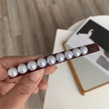 Detail view of burgundy pearl hair clip with gold Barrette La France lettering - Spring Clips / Coffee Rectangle