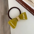 Detail of avocado green resin bow hair tie with high-elastic brown woven band - Yellow-Green