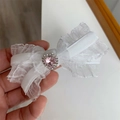 Elegant white lace bow hair clip with a pink heart-shaped rhinestone and silver accent - White Bow Hair Clip