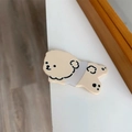 Close-up of a cute cream-colored cartoon dog hair clip made of smooth acrylic material - Beige Duckbill Clip