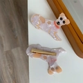 Detailed view of dog-shaped acetate hair clip with gold metal duckbill clamp back - Jack Russell