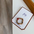 Detail of handmade beaded ring with natural wood cylinders and a bright red agate stone - Wood Color+Round Red Stone