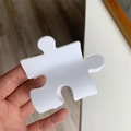 Unique puzzle piece shaped white acetate hair claw clip with functional grip design - White