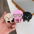 Dettaglio di simpatiche mollette per capelli a forma di cane in beige, rosa e nero - Grande Collezione Beige Rosa Nero