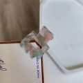 Detail view of small square geometric hair claw clip with pink and green marble texture - Floral Green