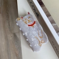 Macro detail of Maneki-Neko acetate hair claw with white marble texture and gold accents - Lucky Cat Hair Claw