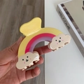 Detail of colorful rainbow hair claw clip with cute smiling clouds and glossy finish - Large / Yellow