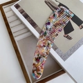 Detail of a thick acetate hair comb with colorful marble texture and ergonomic long handle - Multiple Colors & Patterns