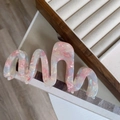 Oversized wavy acetic acid hair claw clip with pink pearlescent marble texture and glossy finish - Pink Wave Hair Claw