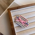 Macro detail of acetate hair clip with colorful stripes, pink bow and rhinestone inlay - Pink Bow Side Clip