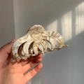 Detail of large acetate hair claw clip with marble texture for thick hair styling - Cream Textured (L1-022CL)