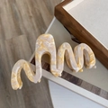 Detail of oversized wavy acetate hair claw clip with beige marble pattern finish - Beige Marble Wave Claw Clip