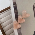 Detail of three marble textured pink heart hair clips on a silver duckbill base - Pink