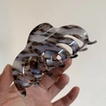 Large ink marble pattern acetate hair claw clip for thick hair shown in hand - Black Gray White Textured (L1-022CL)