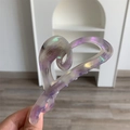 Detailed view of large heart-shaped acetic acid hair claw with purple iridescent marble texture - Large / Purple Textured