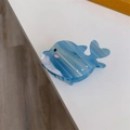 Detail of blue marbled acetate whale hair claw clip with pearl accents and cute design - Blue Blush Fish