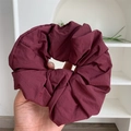 Macro detail of wine red oversized scrunchie showing pleated synthetic fiber texture - Vintage Red Pleated Scrunchie